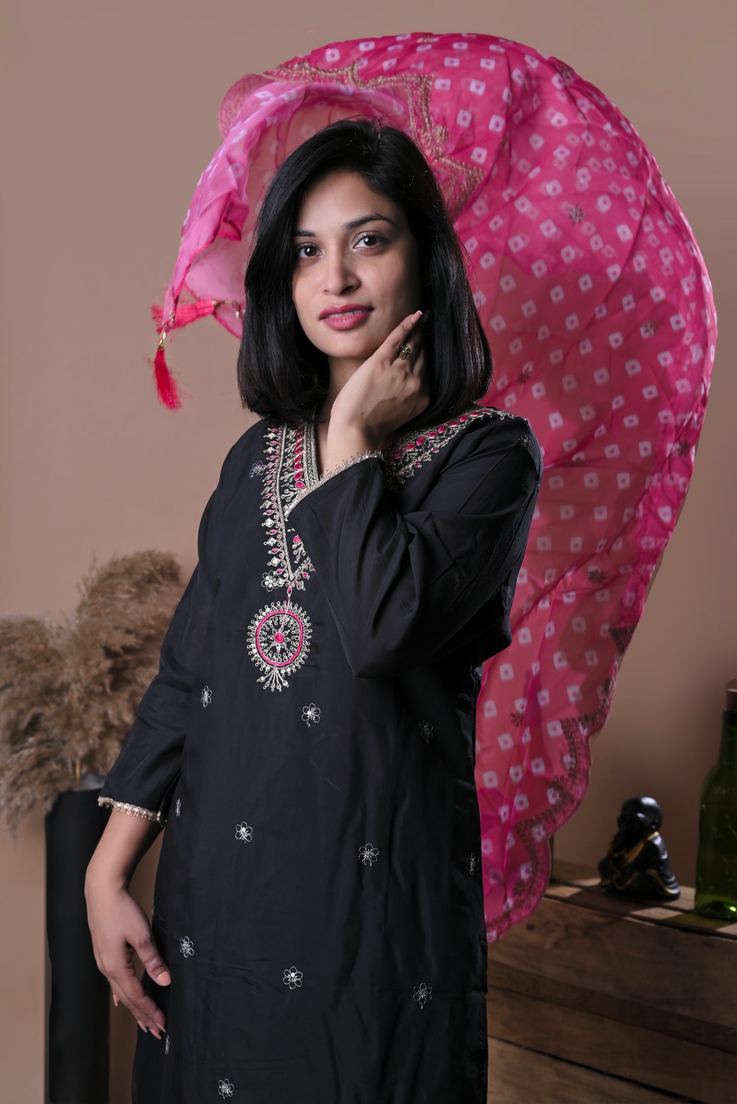 Black embroidered kurta set with pink dupatta